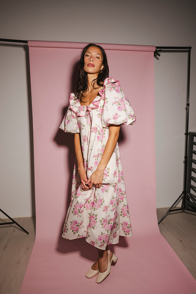 a pink floral puff sleeve dress with a ruffle neckline. the perfect vintage-inspired dress for baby showers, family pictures, + special occasions.
