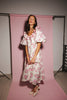 a pink floral puff sleeve dress with a ruffle neckline. the perfect vintage-inspired dress for baby showers, family pictures, + special occasions.
