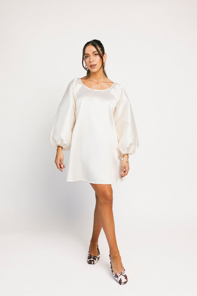 a white satin mini dress with a vintage-inspired silhouette + long balloon sleeves. the perfect little white dress for graduations, bridal showers, + fancy dinner dates.
