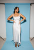 a white satin midi dress with lace detailing + a fitted silhouette. the perfect short sleeve occasion dress for weddings, bridal showers, + dinner parties.
