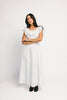 a white vintage-inspired midi dress with a lace ruffle neckline + bow detail. the perfect white dress for bridal showers, rehearsal dinners, + any special occasion.
