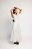 a white vintage-inspired midi dress with a lace ruffle neckline + bow detail. the perfect white dress for bridal showers, rehearsal dinners, + any special occasion.
