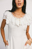 a white vintage-inspired midi dress with a lace ruffle neckline + bow detail. the perfect white dress for bridal showers, rehearsal dinners, + any special occasion.
