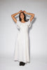 a white vintage-inspired midi dress with a lace ruffle neckline + bow detail. the perfect white dress for bridal showers, rehearsal dinners, + any special occasion.
