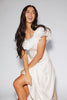 a white vintage-inspired midi dress with a lace ruffle neckline + bow detail. the perfect white dress for bridal showers, rehearsal dinners, + any special occasion.
