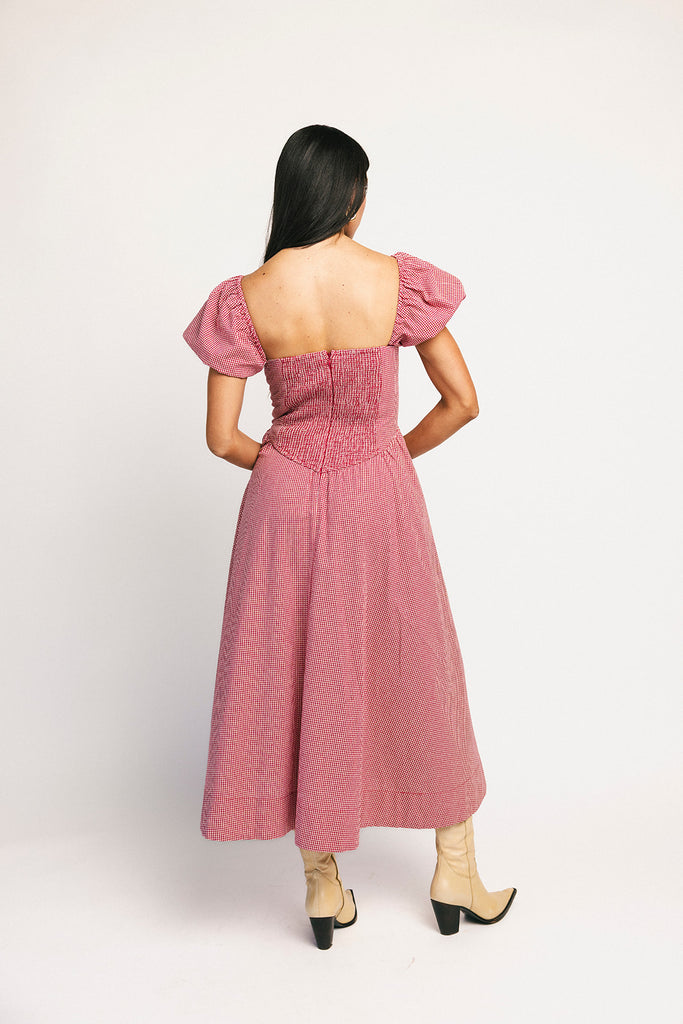 vintage-inspired puff sleeve dress with a square neckline. the perfect red gingham puff sleeve dress for rodeos, family pictures,+ semi-casual occasions.
