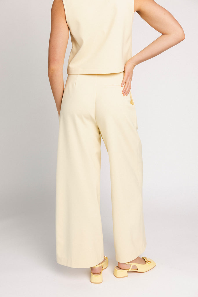 butter yellow pant set with a cropped button up tank + high waisted trousers. the perfect elevated set for the office + everyday wear. 
