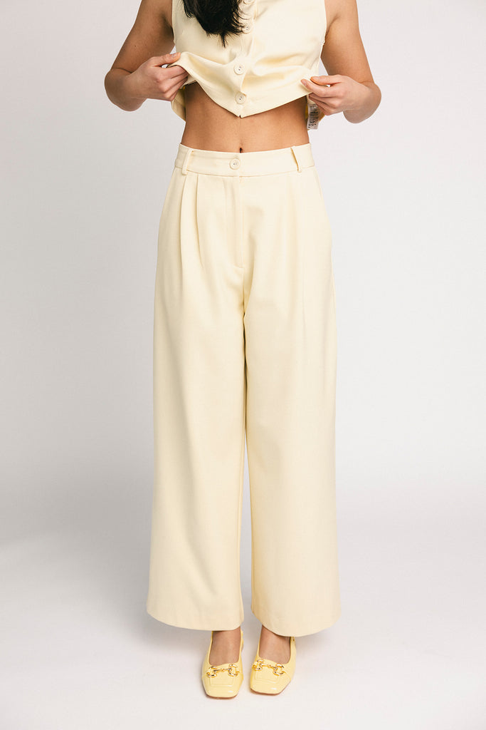 butter yellow pant set with a cropped button up tank + high waisted trousers. the perfect elevated set for the office + everyday wear. 
