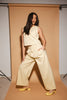 butter yellow pant set with a cropped button up tank + high waisted trousers. the perfect elevated set for the office + everyday wear. 
