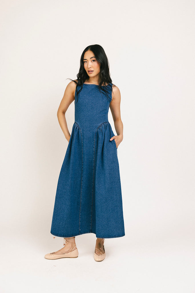 a vintage-inspired denim dress with a boat neckline + a v-shaped waistline. the perfect denim midi dress for family pictures, brunch dates, + special occasions. 
