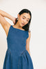 a vintage-inspired denim dress with a boat neckline + a v-shaped waistline. the perfect denim midi dress for family pictures, brunch dates, + special occasions. 

