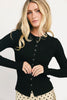 a stretchy black cardigan with a fitted silhouette. the perfect elevated basic for everyday wear + casual outfit styling.
