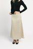 a vintage-inspired polka dot skirt with a dainty bow detail. the perfect slip skirt to dress up or down for any occasion. 
