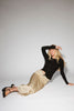 a stretchy black cardigan with a fitted silhouette. the perfect elevated basic for everyday wear + casual outfit styling.
