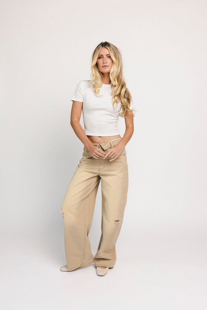 low rise wide leg denim with a folded waistband + distressed details. the perfect y2k-inspired bottoms for date nights + casual wear. 
