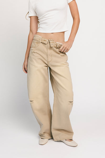 low rise wide leg denim with a folded waistband + distressed details. the perfect y2k-inspired bottoms for date nights + casual wear. 

