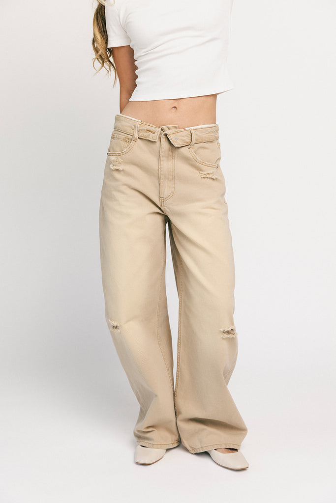 low rise wide leg denim with a folded waistband + distressed details. the perfect y2k-inspired bottoms for date nights + casual wear. 
