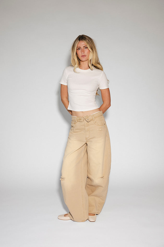 low rise wide leg denim with a folded waistband + distressed details. the perfect y2k-inspired bottoms for date nights + casual wear. 
