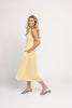 a classic yellow midi dress with a fitted bodice + a v waistline. the perfect vintage-inspired yellow dress for weddings, bridal showers, + garden parties.
