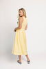 a classic yellow midi dress with a fitted bodice + a v waistline. the perfect vintage-inspired yellow dress for weddings, bridal showers, + garden parties.
