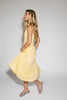 a classic yellow midi dress with a fitted bodice + a v waistline. the perfect vintage-inspired yellow dress for weddings, bridal showers, + garden parties.
