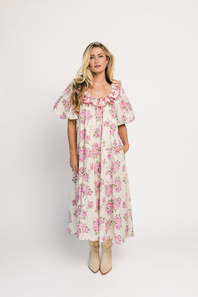 a pink floral puff sleeve dress with a ruffle neckline. the perfect vintage-inspired dress for baby showers, family pictures, + special occasions.
