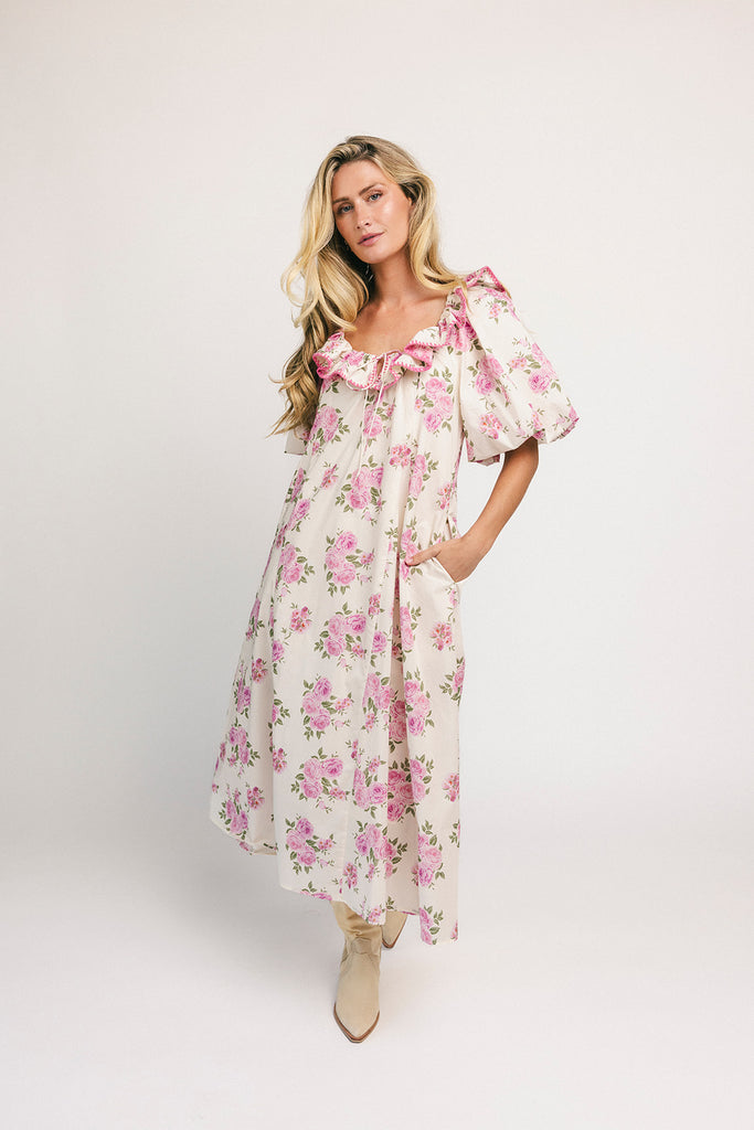 a pink floral puff sleeve dress with a ruffle neckline. the perfect vintage-inspired dress for baby showers, family pictures, + special occasions.
