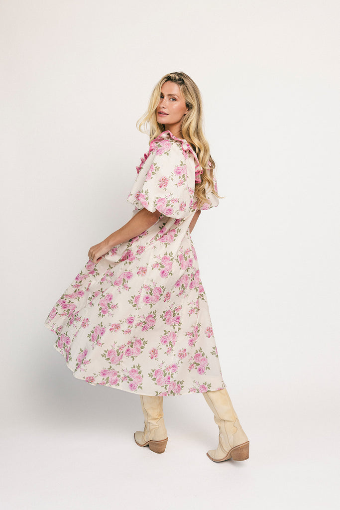 a pink floral puff sleeve dress with a ruffle neckline. the perfect vintage-inspired dress for baby showers, family pictures, + special occasions.
