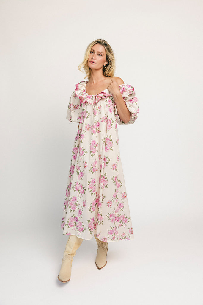 a pink floral puff sleeve dress with a ruffle neckline. the perfect vintage-inspired dress for baby showers, family pictures, + special occasions.
