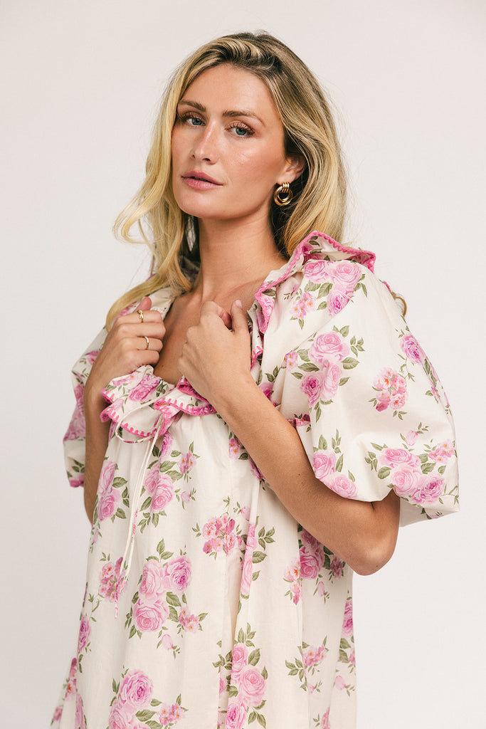 a pink floral puff sleeve dress with a ruffle neckline. the perfect vintage-inspired dress for baby showers, family pictures, + special occasions.

