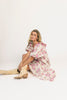 a pink floral puff sleeve dress with a ruffle neckline. the perfect vintage-inspired dress for baby showers, family pictures, + special occasions.
