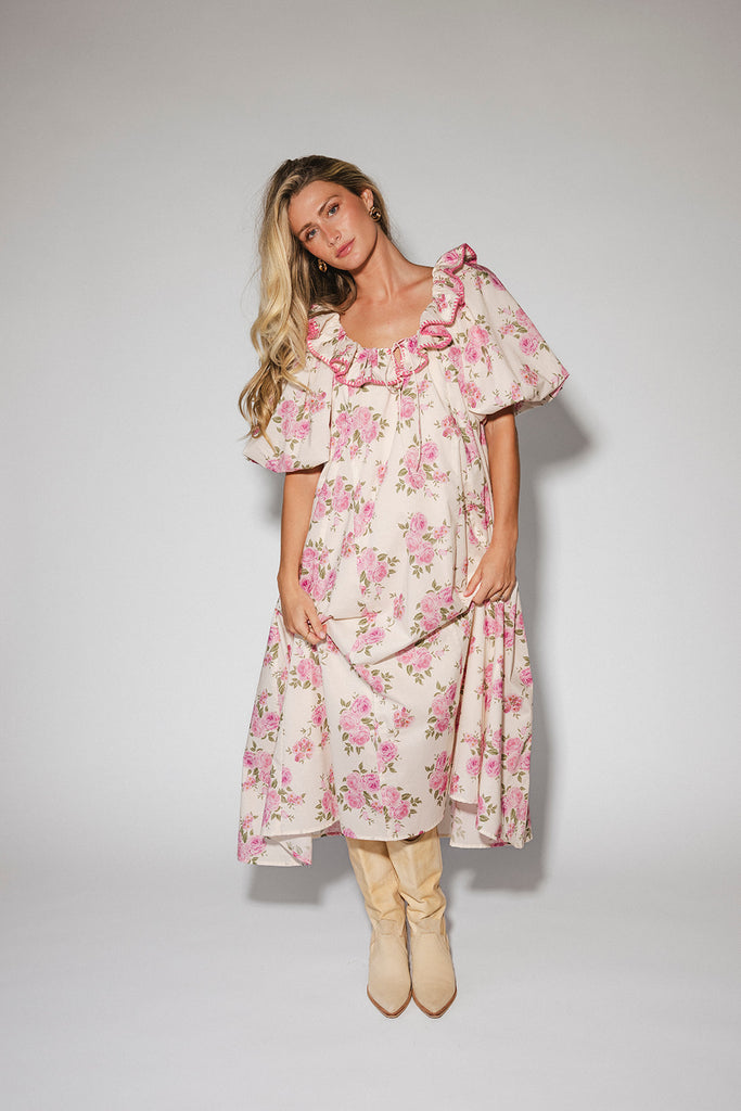 a pink floral puff sleeve dress with a ruffle neckline. the perfect vintage-inspired dress for baby showers, family pictures, + special occasions.
