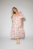 a pink floral puff sleeve dress with a ruffle neckline. the perfect vintage-inspired dress for baby showers, family pictures, + special occasions.
