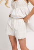white cotton shorts with eyelet details. pair them with the matching white tank top to create the perfect two piece set for brunch dates, vacations, + everyday wear. 