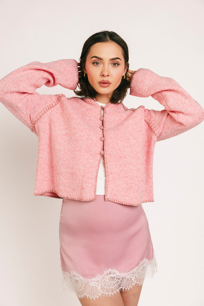 vintage inspired pink cardigan with toggle buttons and an open front. perfect for casual outfits and lightweight layering. 
