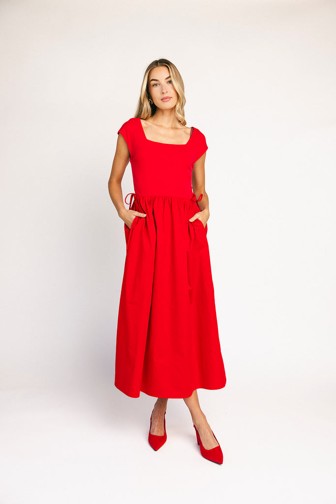zoco afterglow dress: red short sleeve midi dress with a square neckline and side ties. perfect for date nights, weddings, and family pictures.
