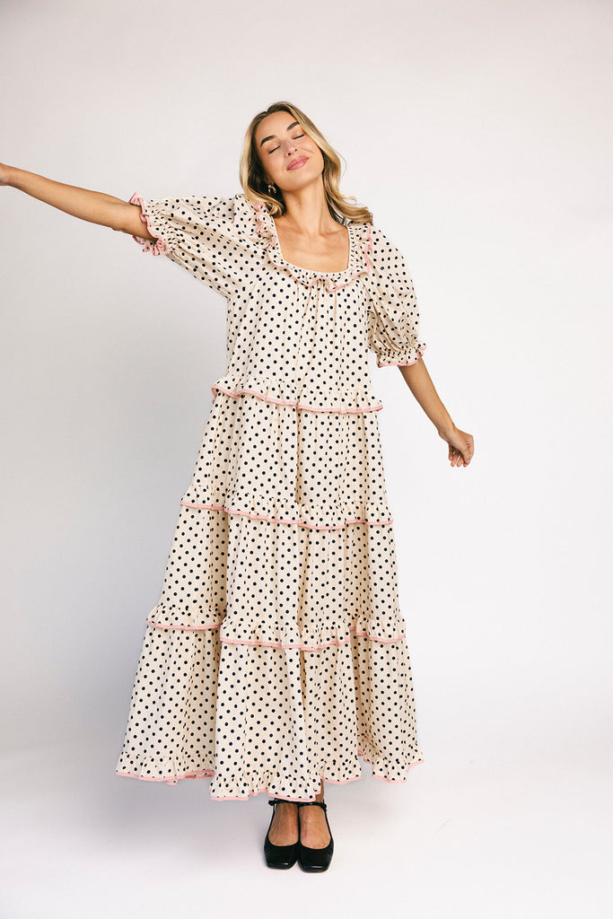 zoco daymaker dress: puff sleeve polka dot dress with an elastic neckline and pink trim details. perfect for weddings, baby showers, and family pictures.