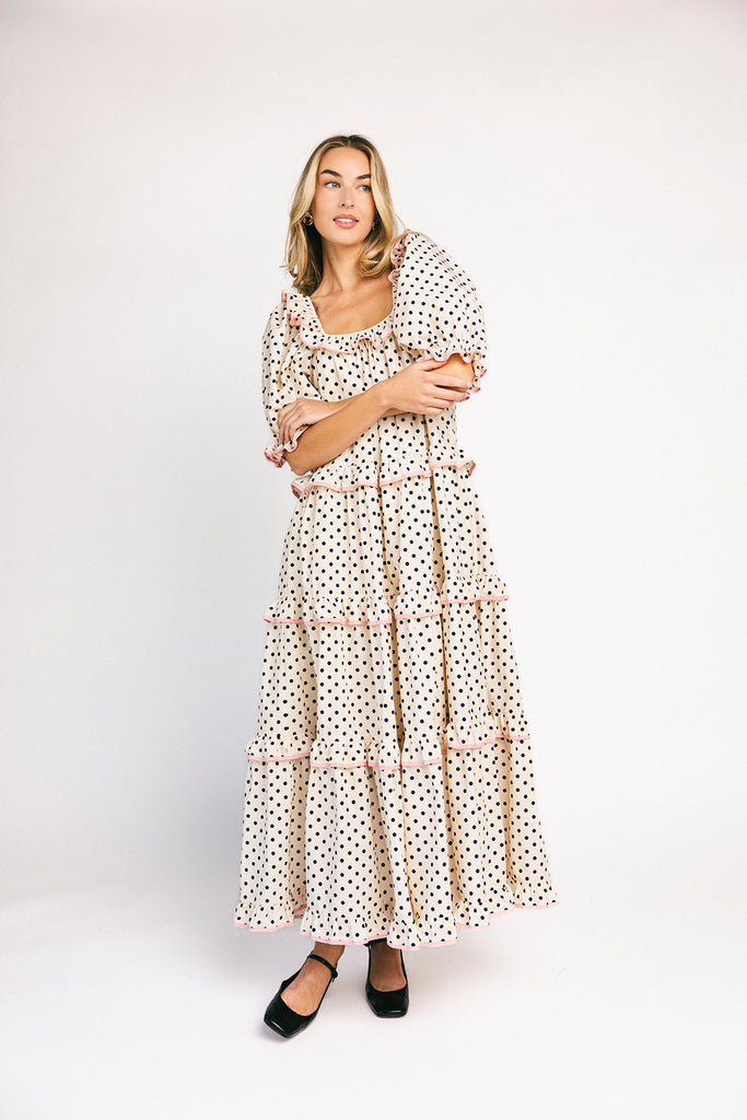 zoco daymaker dress: puff sleeve polka dot dress with an elastic neckline and pink trim details. perfect for weddings, baby showers, and family pictures.