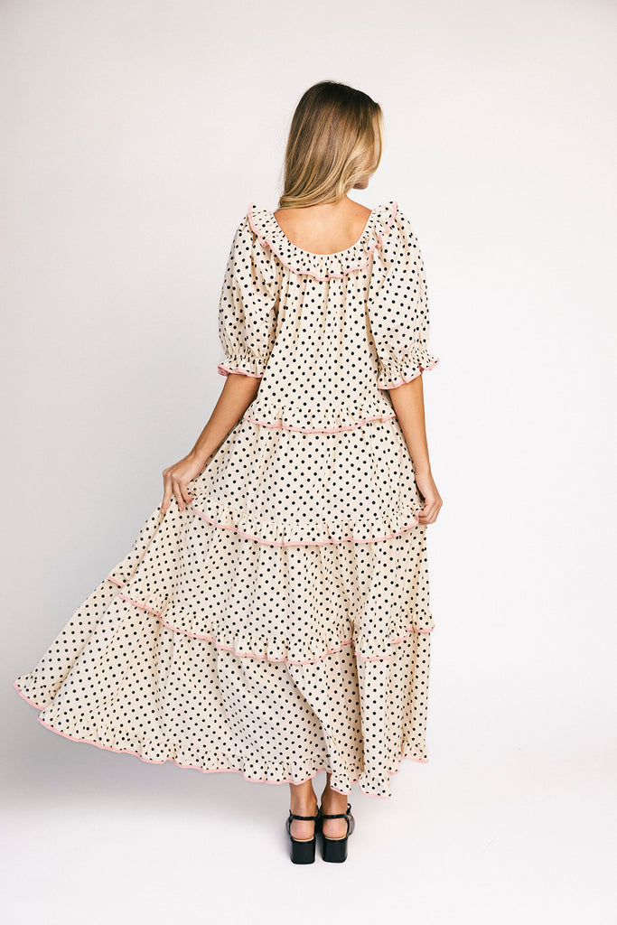 zoco daymaker dress: puff sleeve polka dot dress with an elastic neckline and pink trim details. perfect for weddings, baby showers, and family pictures.