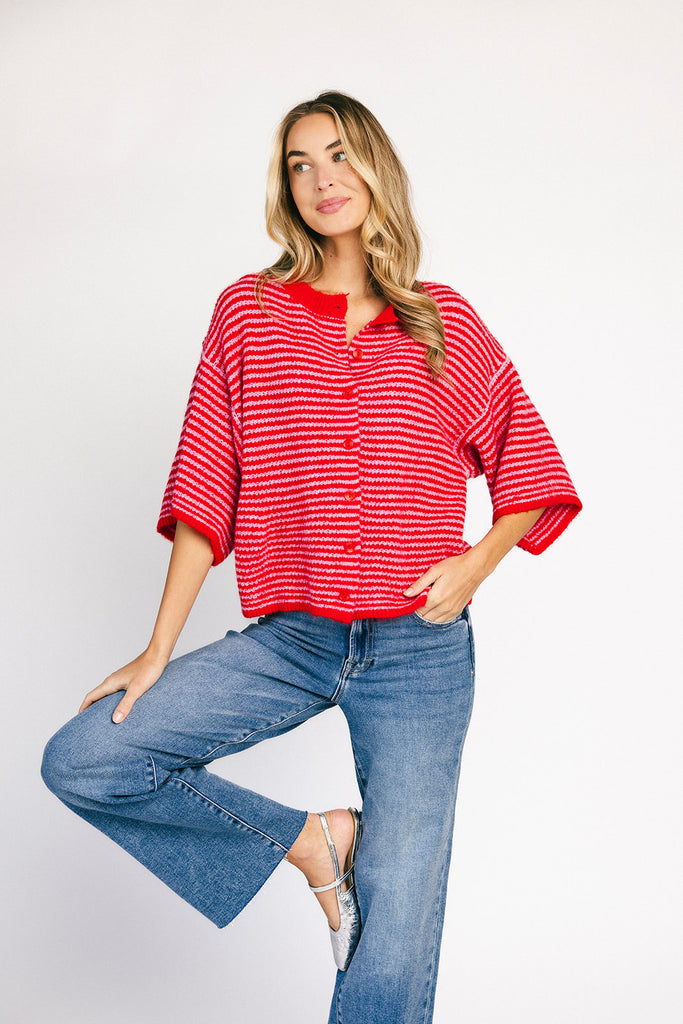 red and pink striped cardigan with short sleeves and a relaxed fit. perfect for casual outfits and lightweight layering. 

