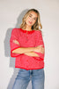 red and pink striped cardigan with short sleeves and a relaxed fit. perfect for casual outfits and lightweight layering. 

