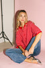 red and pink striped cardigan with short sleeves and a relaxed fit. perfect for casual outfits and lightweight layering. 
