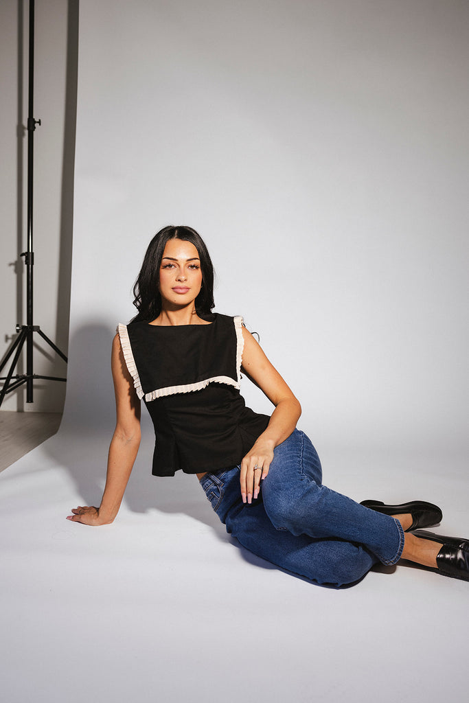 a vintage-inspired fitted tank with an oversized ruffle collar detail. the perfect elevated top for the office + dressy date nights. 