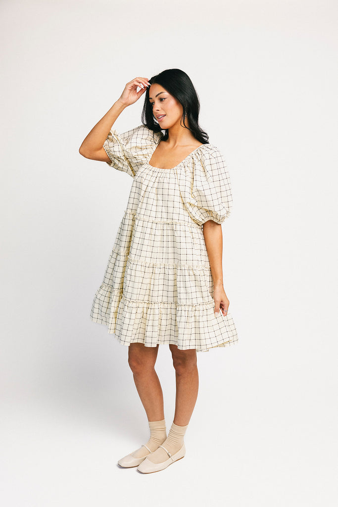 zoco daymaker dress: a short puff sleeve dress with a grid-style pattern + an elastic neckline. perfect for family pictures, weddings, and baby showers.
