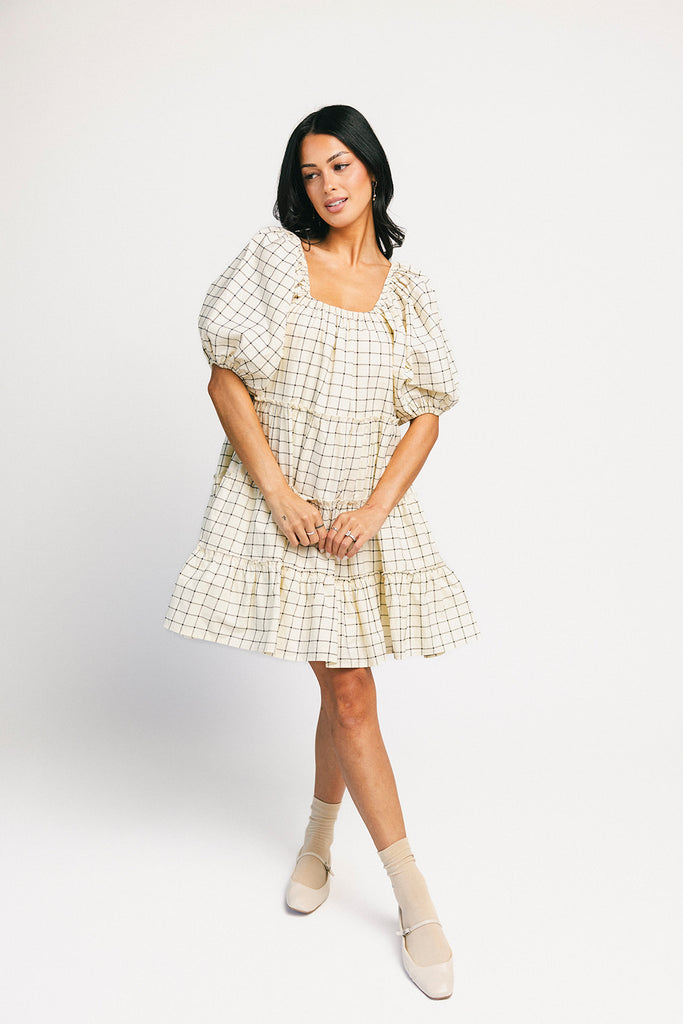 zoco daymaker dress: a short puff sleeve dress with a grid-style pattern + an elastic neckline. perfect for family pictures, weddings, and baby showers.
