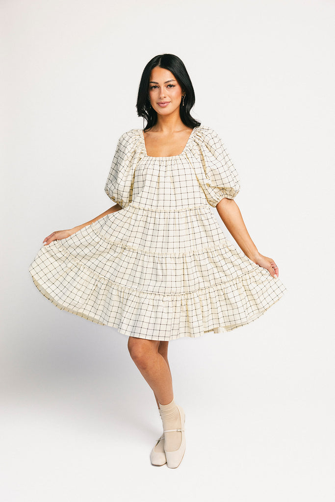 zoco daymaker dress: a short puff sleeve dress with a grid-style pattern + an elastic neckline. perfect for family pictures, weddings, and baby showers.
