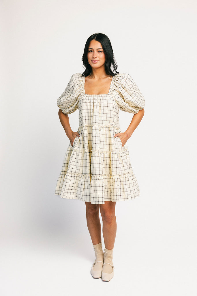 zoco daymaker dress: a short puff sleeve dress with a grid-style pattern + an elastic neckline. perfect for family pictures, weddings, and baby showers.
