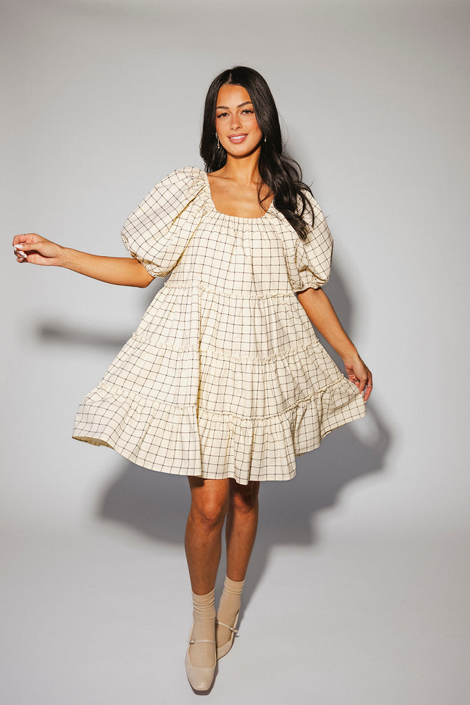 zoco daymaker dress: a short puff sleeve dress with a grid-style pattern + an elastic neckline. perfect for family pictures, weddings, and baby showers.
