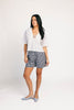 a vintage-inspired short sleeve white top with a relaxed fit + lace trim collar. the perfect elevated basic to dress up or down for any spring + summer outfit idea.