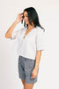 a vintage-inspired short sleeve white top with a relaxed fit + lace trim collar. the perfect elevated basic to dress up or down for any spring + summer outfit idea.